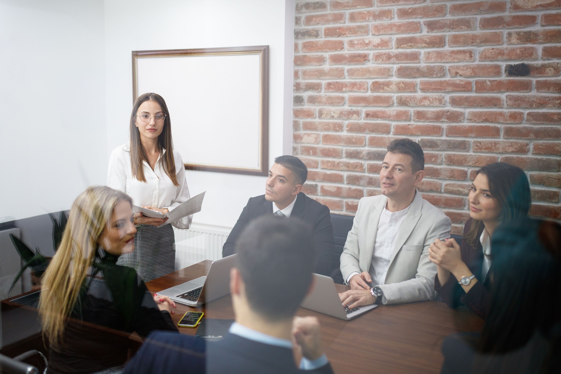 Group of Professionals Having a Meeting in a Modern Office Setting