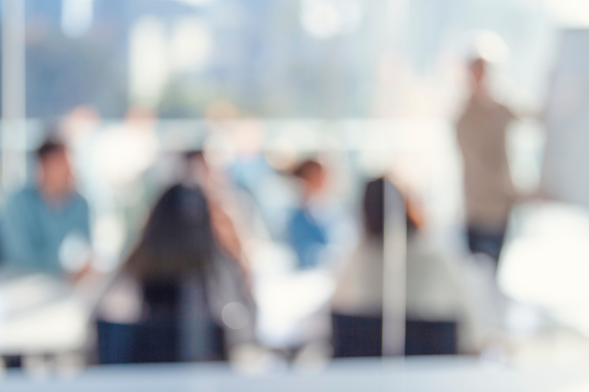 Defocussed image of Business people watching a presentation.