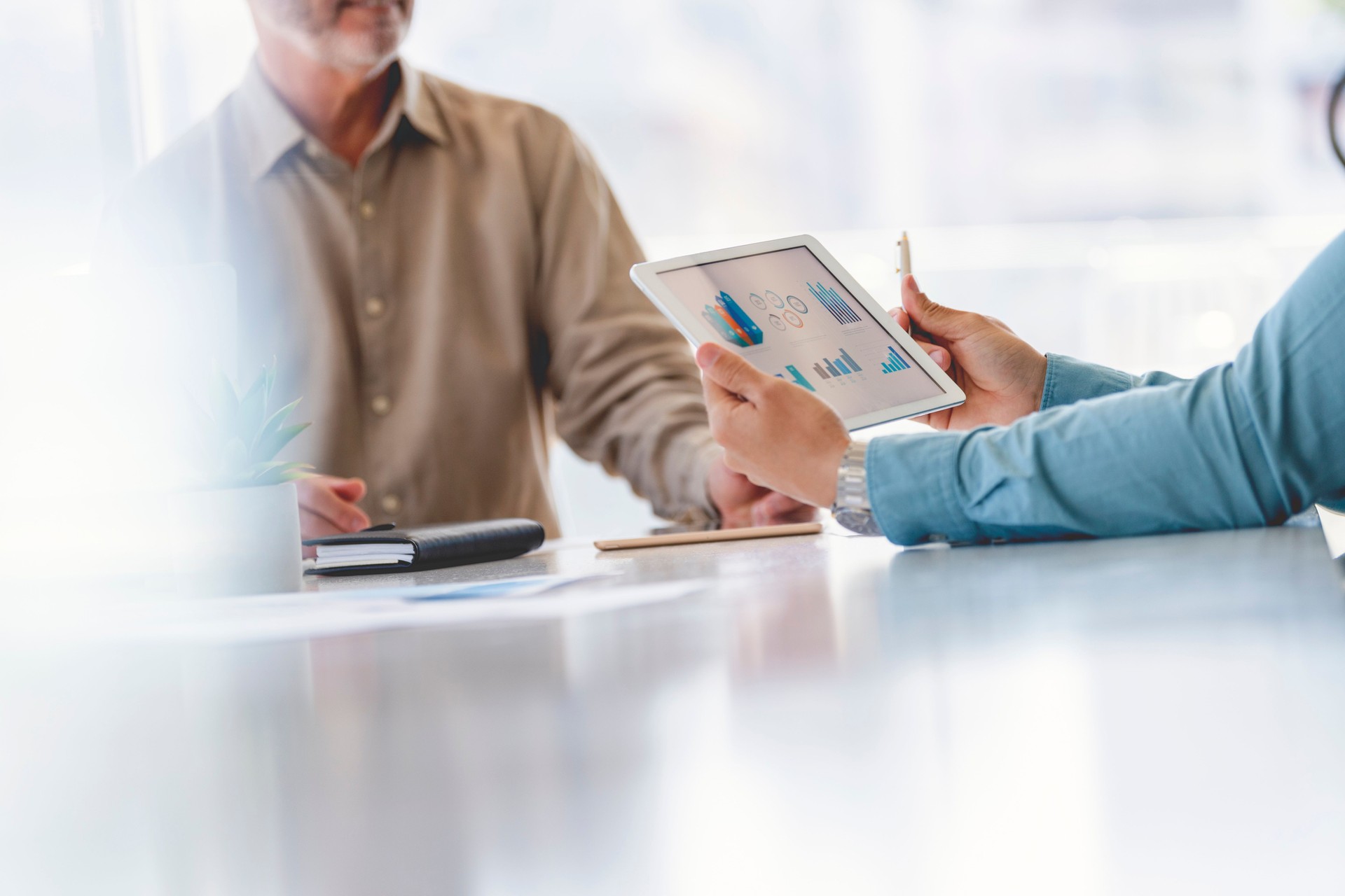 Close up Business people working on financial data on a digital tablet.
